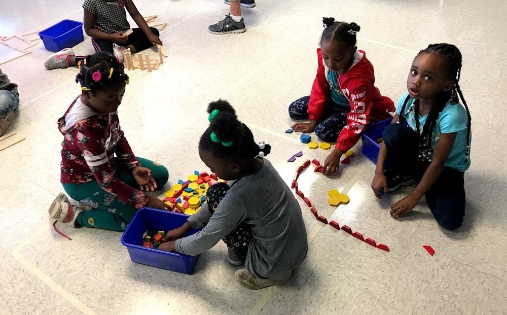 Students playing with shapes